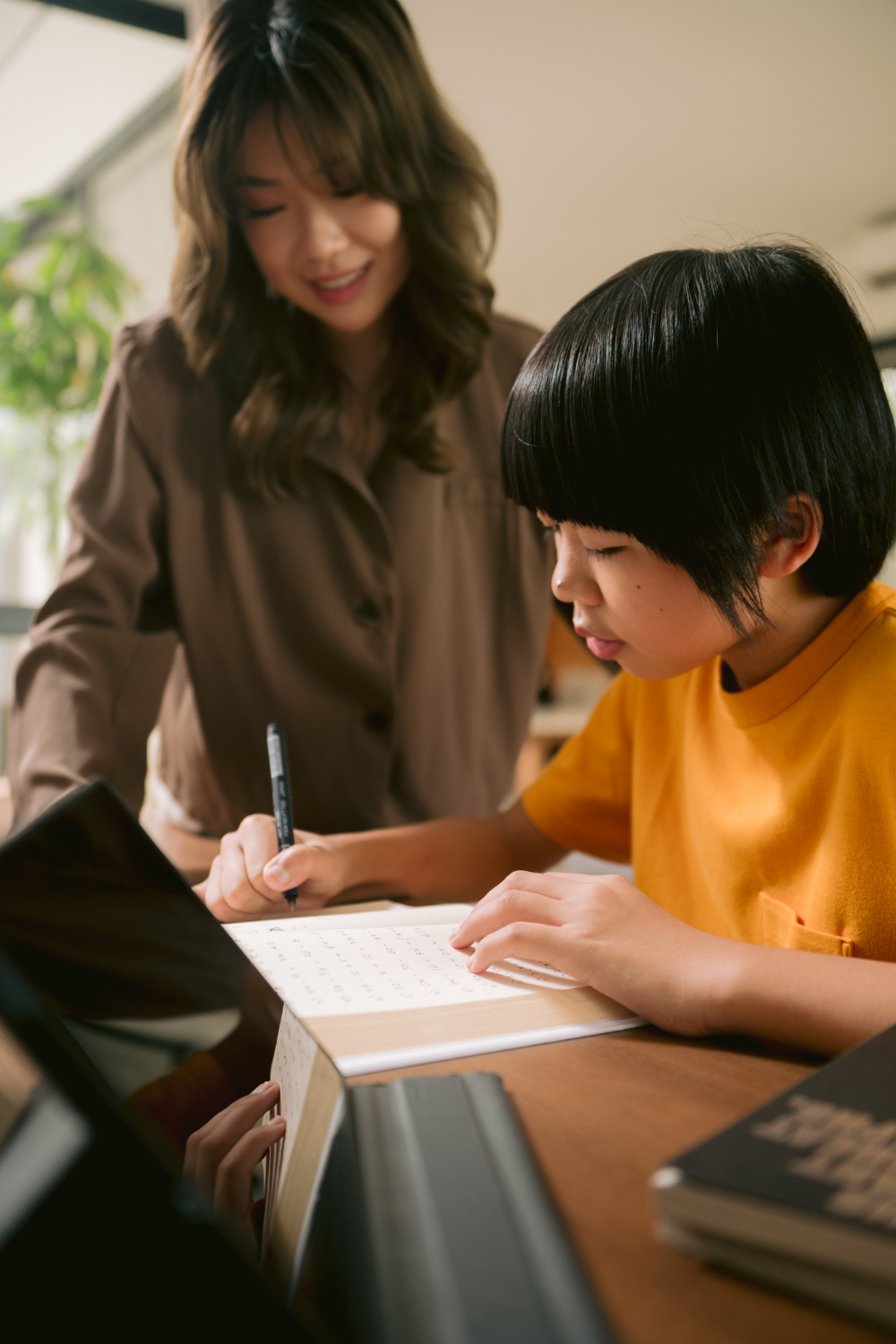 Girl tutoring a child